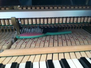 A hair brush found inside a piano